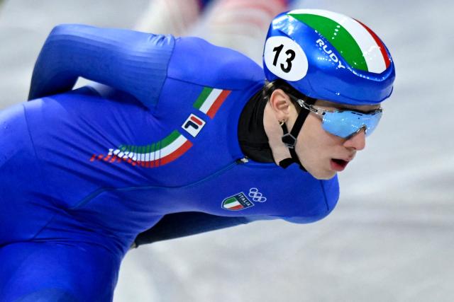 Italy's Thomas Nadalini competes in the short track speed skating men's 1500m semi-final during the Milano Cortina 2026 Winter Olympic Games at Milano Ice Skating Arena in Milan on February 14, 2026. (Photo by WANG Zhao / AFP)