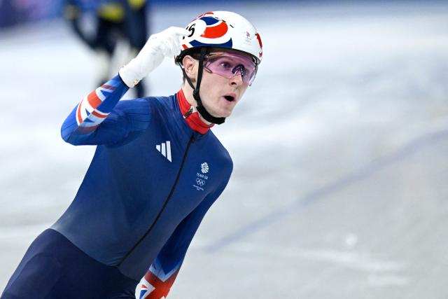 Britain's Niall Treacy reacts after competing in the short track speed skating men's 1500m semi-final during the Milano Cortina 2026 Winter Olympic Games at Milano Ice Skating Arena in Milan on February 14, 2026. (Photo by WANG Zhao / AFP)