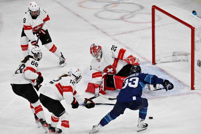 Finland's #33 Michelle Karvinen controls the puck during the women's quarter final ice hockey match between Finland and Switzerland at the Milano Rho Ice Hockey Arena at the Milano Cortina 2026 Winter Olympic Games in Milan, on February 14, 2026. (Photo by Alexander NEMENOV / AFP)