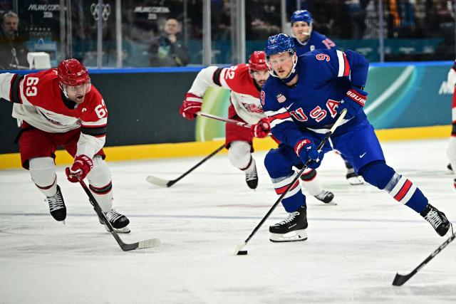 USA's #09 Jack Eichel controls the puck during the men's preliminary round Group C Ice Hockey match between USA and Denmark at the Milano Santagiulia Ice Hockey Arena during the Milano Cortina 2026 Winter Olympic Games in Milan, on February 14, 2026. (Photo by JULIEN DE ROSA / AFP)