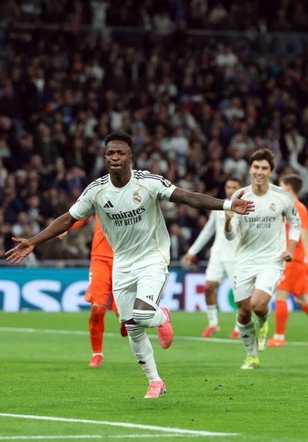 Real Madrid's Brazilian forward #07 Vinicius Junior celebrates scoring his team's fourth goal during the Spanish league football match between Real Madrid CF and Real Sociedad at Santiago Bernabeu Stadium in Madrid on February 14, 2026. (Photo by Pierre-Philippe MARCOU / AFP)