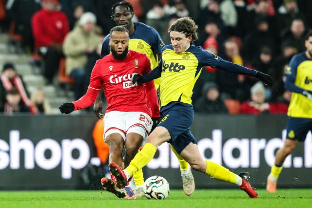 Standard's Marco Ilaimaharitra and Union's Kamiel Van De Perre fight for the ball during the Belgian "Pro League" First Division football match between Standard Liege and Royale Union Saint-Gilloise  at Stade Maurice Dufrasne in Liege on February 14, 2026. (Photo by BRUNO FAHY / BELGA / AFP) / Belgium OUT