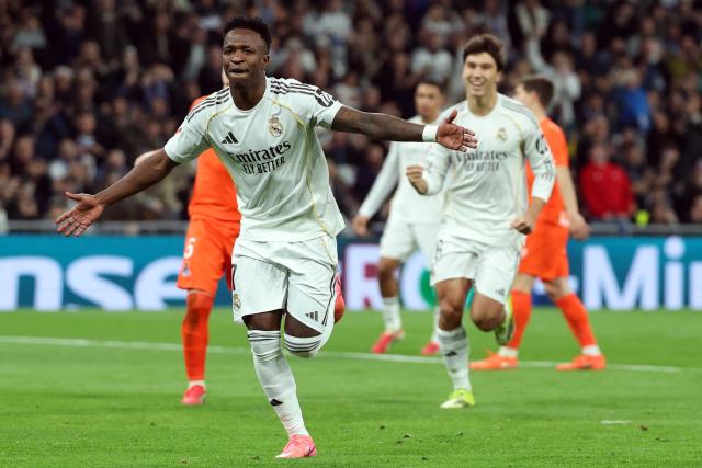 TOPSHOT - Real Madrid's Brazilian forward #07 Vinicius Junior celebrates scoring his team's fourth goal during the Spanish league football match between Real Madrid CF and Real Sociedad at Santiago Bernabeu Stadium in Madrid on February 14, 2026. (Photo by Pierre-Philippe MARCOU / AFP)