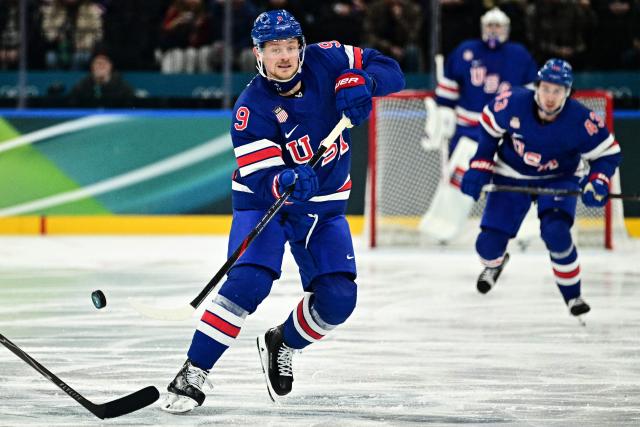 USA's #09 Jack Eichel vies for the puck during the men's preliminary round Group C Ice Hockey match between USA and Denmark at the Milano Santagiulia Ice Hockey Arena during the Milano Cortina 2026 Winter Olympic Games in Milan, on February 14, 2026. (Photo by JULIEN DE ROSA / AFP)