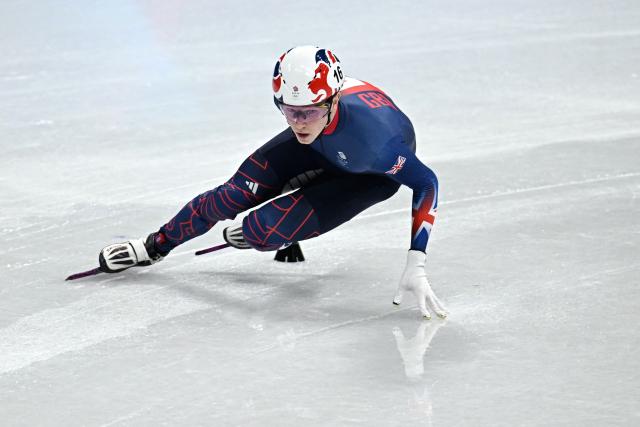 Britain's Niall Treacy competes in the short track speed skating men's 1500m semi-final during the Milano Cortina 2026 Winter Olympic Games at Milano Ice Skating Arena in Milan on February 14, 2026. (Photo by Gabriel BOUYS / AFP)