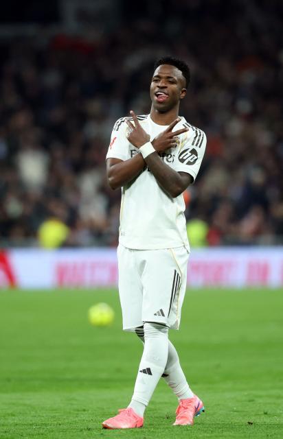 Real Madrid's Brazilian forward #07 Vinicius Junior celebrates scoring his team's fourth goal during the Spanish league football match between Real Madrid CF and Real Sociedad at Santiago Bernabeu Stadium in Madrid on February 14, 2026. (Photo by Pierre-Philippe MARCOU / AFP)