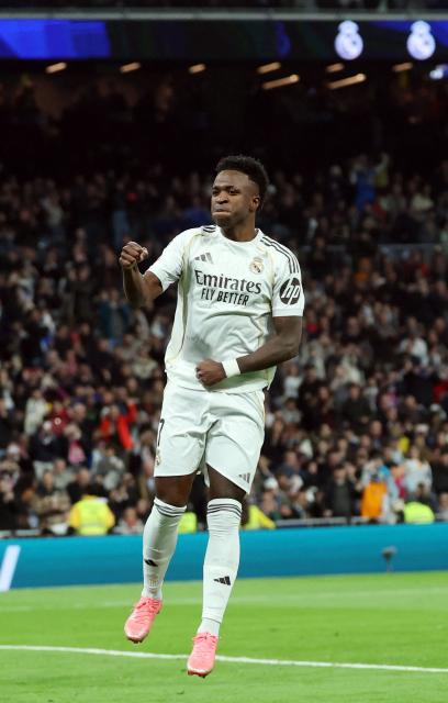 Real Madrid's Brazilian forward #07 Vinicius Junior celebrates scoring his team's fourth goal during the Spanish league football match between Real Madrid CF and Real Sociedad at Santiago Bernabeu Stadium in Madrid on February 14, 2026. (Photo by Pierre-Philippe MARCOU / AFP)
