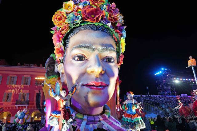 Artists perform during the opening parade of the 141th edition of the Nice Carnival in the French Riviera City of Nice on February 14, 2026. (Photo by Valery HACHE / AFP)