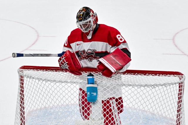 Denmark's #80 Frederik Dichow reacts during the men's preliminary round Group C Ice Hockey match between USA and Denmark at the Milano Santagiulia Ice Hockey Arena during the Milano Cortina 2026 Winter Olympic Games in Milan, on February 14, 2026. (Photo by JULIEN DE ROSA / POOL / AFP)