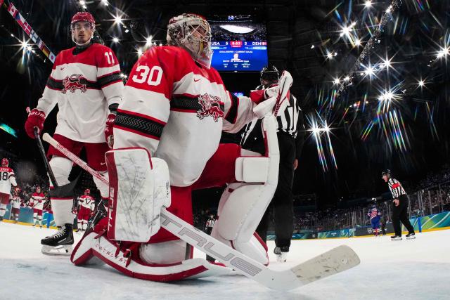 Denmark's #30 Mads Sogaard reacts during the men's preliminary round Group C Ice Hockey match between USA and Denmark at the Milano Santagiulia Ice Hockey Arena during the Milano Cortina 2026 Winter Olympic Games in Milan, on February 14, 2026. (Photo by POOL / AFP)