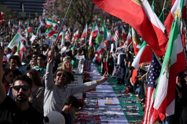 Demonstrators rally in solidarity with the Iranian protest movement in Los Angeles on February 14, 2026. The exiled son of Iran's last shah said he was ready to lead the country to a "secular democratic future" at a rally in Munich on Saturday, after US President Donald Trump said a change of power would be the "best thing". (Photo by Patrick T. Fallon / AFP)