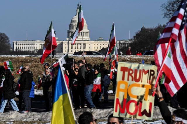 Demonstrators take part in a march in support of the people of Iran by members of the American-Iranian community in Washington, DC, on February 14, 2026. The demonstration comes after the bloody crackdown on protesters last month, while US President Donald Trump has been massing warships in the Middle East and declared Friday that a change of government in Iran would be the "best thing that could happen". (Photo by ROBERTO SCHMIDT / AFP)
