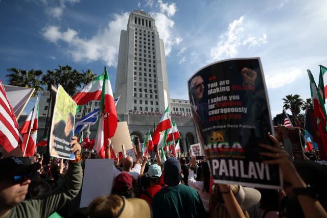 Demonstrators rally in solidarity with the Iranian protest movement in Los Angeles on February 14, 2026. The exiled son of Iran's last shah said he was ready to lead the country to a "secular democratic future" at a rally in Munich on Saturday, after US President Donald Trump said a change of power would be the "best thing". (Photo by Patrick T. Fallon / AFP)