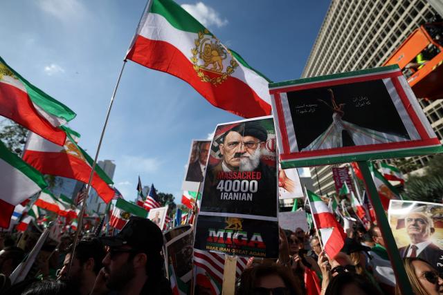 Demonstrators rally in solidarity with the Iranian protest movement in Los Angeles on February 14, 2026. The exiled son of Iran's last shah said he was ready to lead the country to a "secular democratic future" at a rally in Munich on Saturday, after US President Donald Trump said a change of power would be the "best thing". (Photo by Patrick T. Fallon / AFP)