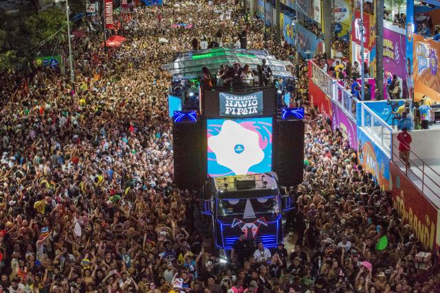 BaianaSystem carnival group parade in Salvador, Bahia, Brazil on February 14, 2026. BaianaSystem revolutionized Bahian music by blending the traditional Bahian guitar with the aesthetics of Jamaican sound systems, Afro-Brazilian rhythms (afoxé, ijexá, samba-reggae), and electronic music. (Photo by Antonello Veneri / AFP)