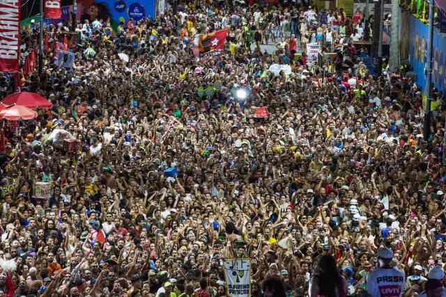 BaianaSystem carnival group parade in Salvador, Bahia, Brazil on February 14, 2026. BaianaSystem revolutionized Bahian music by blending the traditional Bahian guitar with the aesthetics of Jamaican sound systems, Afro-Brazilian rhythms (afoxé, ijexá, samba-reggae), and electronic music. (Photo by Antonello Veneri / AFP)