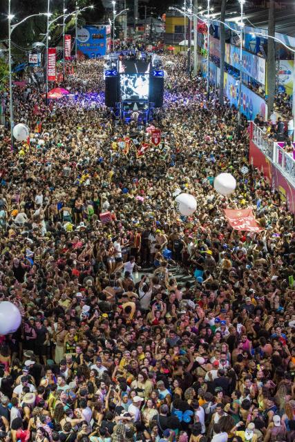 BaianaSystem carnival group parade in Salvador, Bahia, Brazil on February 14, 2026. BaianaSystem revolutionized Bahian music by blending the traditional Bahian guitar with the aesthetics of Jamaican sound systems, Afro-Brazilian rhythms (afoxé, ijexá, samba-reggae), and electronic music. (Photo by Antonello Veneri / AFP)