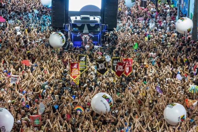 BaianaSystem carnival group parade in Salvador, Bahia, Brazil on February 14, 2026. BaianaSystem revolutionized Bahian music by blending the traditional Bahian guitar with the aesthetics of Jamaican sound systems, Afro-Brazilian rhythms (afoxé, ijexá, samba-reggae), and electronic music. (Photo by Antonello Veneri / AFP)