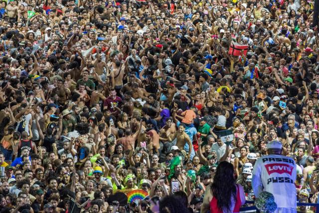 BaianaSystem carnival group parade in Salvador, Bahia, Brazil on February 14, 2026. BaianaSystem revolutionized Bahian music by blending the traditional Bahian guitar with the aesthetics of Jamaican sound systems, Afro-Brazilian rhythms (afoxé, ijexá, samba-reggae), and electronic music. (Photo by Antonello Veneri / AFP)