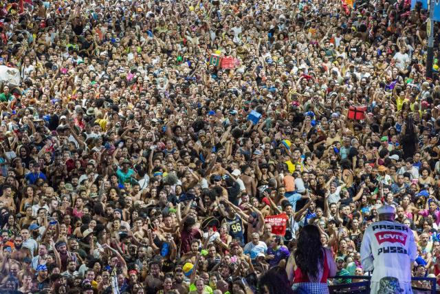 BaianaSystem carnival group parade in Salvador, Bahia, Brazil on February 14, 2026. BaianaSystem revolutionized Bahian music by blending the traditional Bahian guitar with the aesthetics of Jamaican sound systems, Afro-Brazilian rhythms (afoxé, ijexá, samba-reggae), and electronic music. (Photo by Antonello Veneri / AFP)
