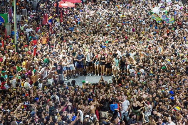 BaianaSystem carnival group parade in Salvador, Bahia, Brazil on February 14, 2026. BaianaSystem revolutionized Bahian music by blending the traditional Bahian guitar with the aesthetics of Jamaican sound systems, Afro-Brazilian rhythms (afoxé, ijexá, samba-reggae), and electronic music. (Photo by Antonello Veneri / AFP)