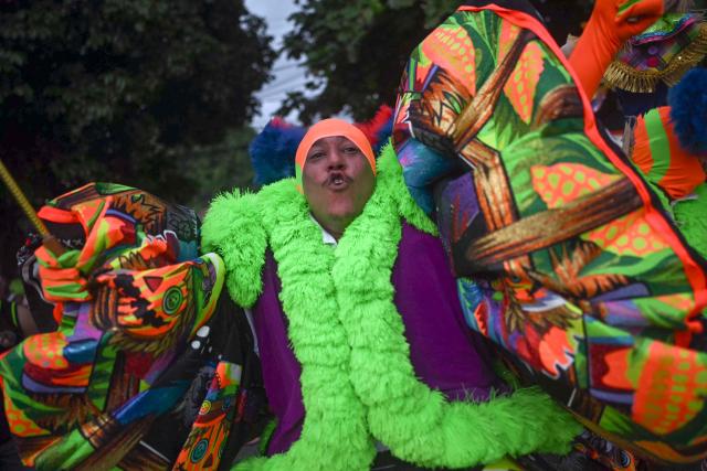 Members of Dito e Feito bate-bola street carnival group parade at Iraja neighbourhood, in the suburbs of Rio de Janeiro, Brazil on February 14, 2026. (Photo by MAURO PIMENTEL / AFP)