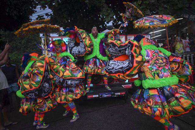 Members of Dito e Feito bate-bola street carnival group parade at Iraja neighbourhood, in the suburbs of Rio de Janeiro, Brazil on February 14, 2026. (Photo by MAURO PIMENTEL / AFP)