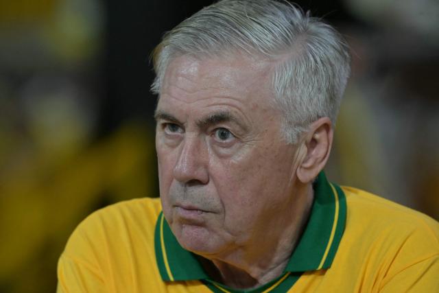 Brazil's Italian head coach Carlo Ancelotti gestures while attending the second night of carnival parade in the Sambadrome in Sao Paulo, Brazil, on February 14, 2026. (Photo by NELSON ALMEIDA / AFP)