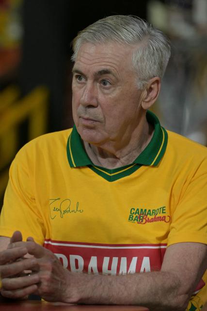 Brazil's Italian head coach Carlo Ancelotti gestures while attending the second night of carnival parade in the Sambadrome in Sao Paulo, Brazil, on February 14, 2026. (Photo by NELSON ALMEIDA / AFP)