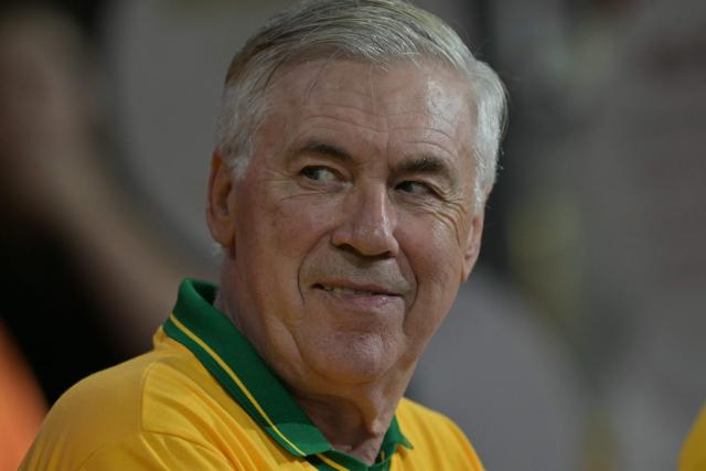 Brazil's Italian head coach Carlo Ancelotti gestures while attending the second night of carnival parade in the Sambadrome in Sao Paulo, Brazil, on February 14, 2026. (Photo by NELSON ALMEIDA / AFP)