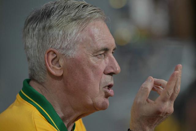 Brazil's Italian head coach Carlo Ancelotti gestures while attending the second night of carnival parade in the Sambadrome in Sao Paulo, Brazil, on February 14, 2026. (Photo by NELSON ALMEIDA / AFP)