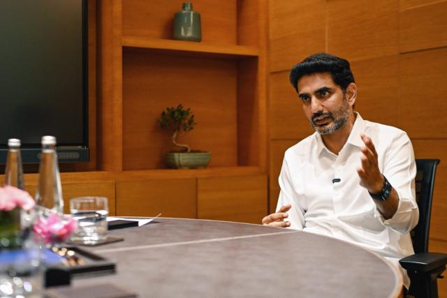 This photograph taken on January 4, 2026 shows information technology minister for India's Andhra Pradesh state Nara Lokesh speaking during an interview with AFP in New Delhi. As India races to narrow the artificial intelligence gap with the United States and China, it is planning a vast new "data city" to power digital growth on a staggering scale, the man spearheading the project says. (Photo by Arun SANKAR / AFP) / To go with 'India-Economy-Technology-AI'