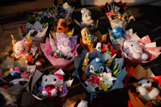 Valentine's Day gifts are display for sale at a street stall in Mexico City on February 14, 2026. (Photo by Rodrigo OROPEZA / AFP)