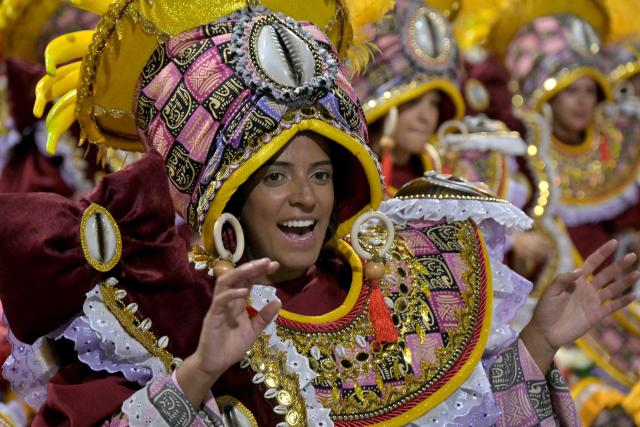 Revellers of the Imperio de Casa Verde samba school perform during the carnival parade at the Anhembi Sambadrome in Sao Paulo, Brazil, on February 14, 2026. (Photo by Nelson ALMEIDA / AFP)