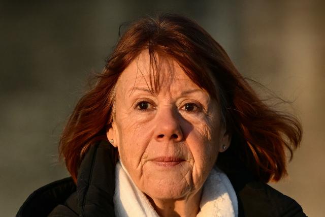 (FILES) Gisele Pelicot looks on as she arrives at the Avignon courthouse for the trial of her former partner Dominique Pelicot accused of drugging her for nearly ten years and inviting strangers to rape her at their home in Mazan, a small town in the south of France, in Avignon, on December 10, 2024. It is undoubtedly the most eagerly awaited book of the year: in her memoirs, to be published on February 17, 2026 Gisele Pelicot tells for the first time the rapes organised by her ex-husband and the historic trial in Avignon, which made her a leading figure in the fight against sexual violence. (Photo by Christophe SIMON / AFP)