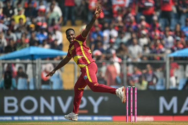 West Indies' Matthew Forde celebrates after taking the wicket of Nepal's captain Rohit Paudel during the 2026 ICC Men's T20 Cricket World Cup group stage match between Nepal and West Indies at the Wankhede Stadium in Mumbai on February 15, 2026. (Photo by Indranil MUKHERJEE / AFP)