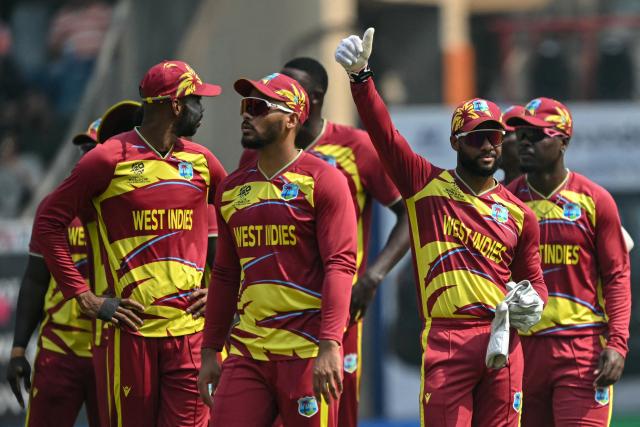 West Indies' captain Shai Hope (2R) gestures during the 2026 ICC Men's T20 Cricket World Cup group stage match between Nepal and West Indies at the Wankhede Stadium in Mumbai on February 15, 2026. (Photo by Indranil MUKHERJEE / AFP)