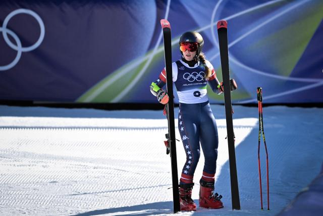 Mikaela Shiffrin USA's reacts in the finish area after competing in the first run of the women's giant slalom event during the Milano Cortina 2026 Winter Olympic Games at the Tofane Alpine Skiing Centre in Cortina d’Ampezzo on February 15, 2026. (Photo by Tiziana FABI / AFP)