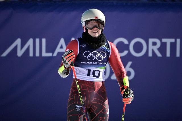 Lara Colturi Albania's reacts in the finish area after competing in the first run of the women's giant slalom event during the Milano Cortina 2026 Winter Olympic Games at the Tofane Alpine Skiing Centre in Cortina d’Ampezzo on February 15, 2026. (Photo by Tiziana FABI / AFP)