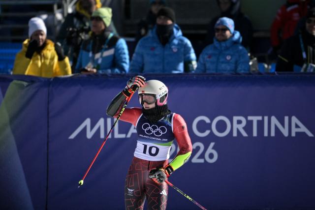 Lara Colturi Albania's reacts in the finish area after competing in the first run of the women's giant slalom event during the Milano Cortina 2026 Winter Olympic Games at the Tofane Alpine Skiing Centre in Cortina d’Ampezzo on February 15, 2026. (Photo by Tiziana FABI / AFP)