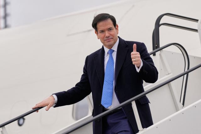 US Secretary of State Marco Rubio gives a thumbs up as he disembarks his plane after landing at the Bratislava Airport in Bratislava, Slovakia, on February 15, 2026. (Photo by Alex Brandon / POOL / AFP)