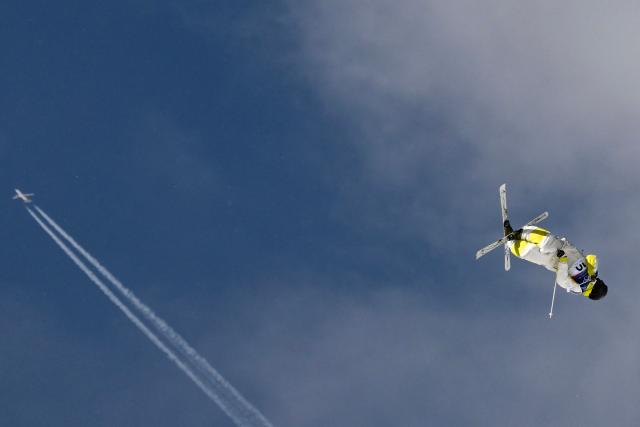 TOPSHOT - Kazakhstan's Pavel Kolmakov competes in the freestyle skiing men's dual moguls last 16 during the Milano Cortina 2026 Winter Olympic Games at Livigno Aerials & Moguls Park, in Livigno (Valtellina), on February 15, 2026. (Photo by Jeff PACHOUD / AFP)