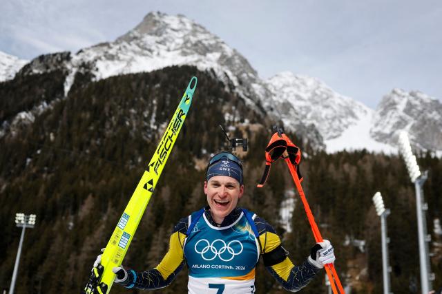 Sweden's Martin Ponsiluoma poses after crossing the finish line during the men's biathlon 12,5km pursuit event during the Milano Cortina 2026 Winter Olympic Games at the Anterselva Biathlon Arena (Sudtirol Arena) in Anterselva (Val Pusteria) on February 15, 2026. (Photo by Odd ANDERSEN / AFP)