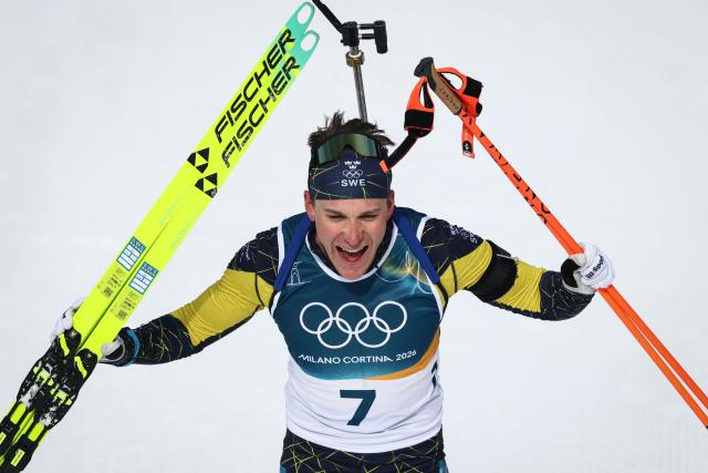 Sweden's Martin Ponsiluoma celebrates after crossing the finish line during the men's biathlon 12,5km pursuit event during the Milano Cortina 2026 Winter Olympic Games at the Anterselva Biathlon Arena (Sudtirol Arena) in Anterselva (Val Pusteria) on February 15, 2026. (Photo by FRANCK FIFE / AFP)