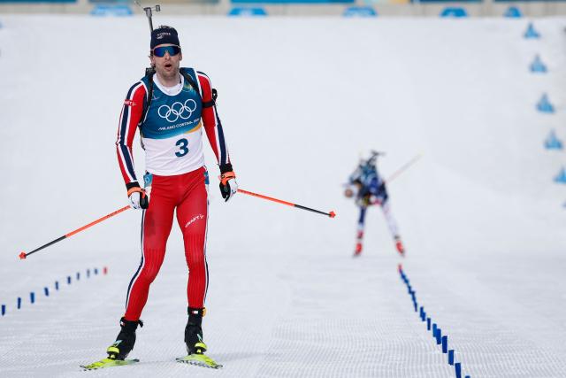 Norway's Sturla Holm Laegreid reacts while crossing the finish line during the men's biathlon 12,5km pursuit event during the Milano Cortina 2026 Winter Olympic Games at the Anterselva Biathlon Arena (Sudtirol Arena) in Anterselva (Val Pusteria) on February 15, 2026. (Photo by Odd ANDERSEN / AFP)