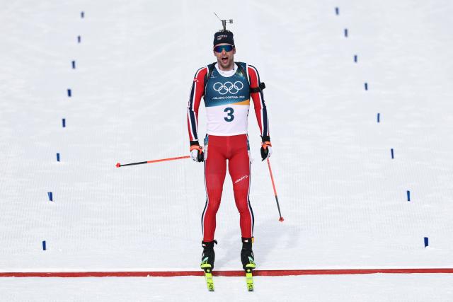 Norway's Sturla Holm Laegreid reacts whiel crossing the finish line during the men's biathlon 12,5km pursuit event during the Milano Cortina 2026 Winter Olympic Games at the Anterselva Biathlon Arena (Sudtirol Arena) in Anterselva (Val Pusteria) on February 15, 2026. (Photo by FRANCK FIFE / AFP)