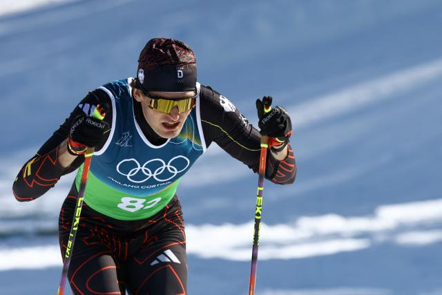 Germany's Friedrich Moch competes during the cross-country men's 4 x 7,5km relay event of the Milano Cortina 2026 Winter Olympic Games at Tesero Cross-Country Skiing Stadium in Lago di Tesero (Val di Fiemme), on February 15, 2026. (Photo by Anne-Christine POUJOULAT / AFP)