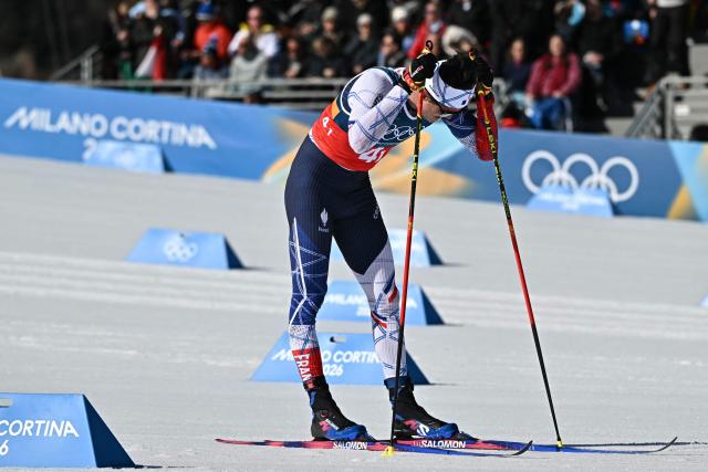 France's Theo Schely reacts after competing during the cross-country men's 4 x 7,5km relay event of the Milano Cortina 2026 Winter Olympic Games at Tesero Cross-Country Skiing Stadium in Lago di Tesero (Val di Fiemme), on February 15, 2026. (Photo by Javier SORIANO / AFP)