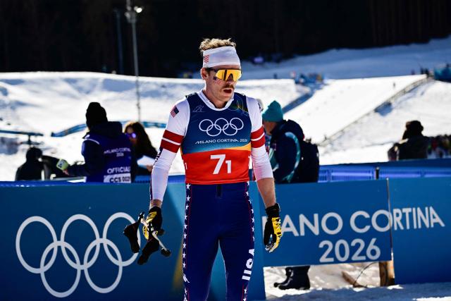USA's Ben Ogden reacts after competing during the cross-country men's 4 x 7,5km relay event of the Milano Cortina 2026 Winter Olympic Games at Tesero Cross-Country Skiing Stadium in Lago di Tesero (Val di Fiemme), on February 15, 2026. (Photo by Tobias SCHWARZ / AFP)