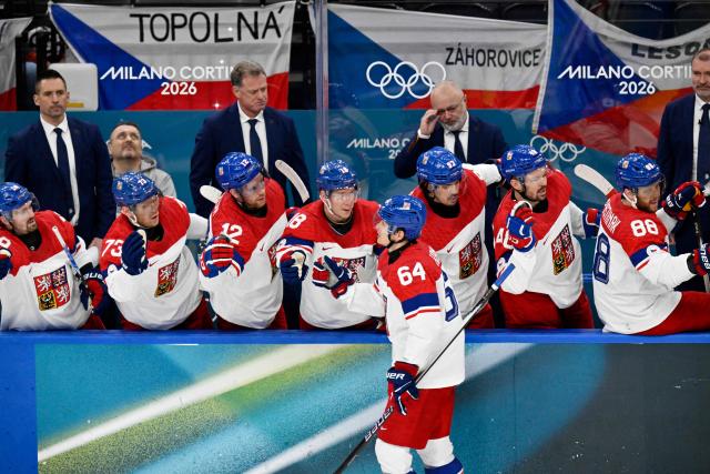 Czech Republic's #64 David Kampf celebrates with team mates after Czech Republic's #14 Filip Chlapik scored his team's first goal during men's preliminary round Group A Ice Hockey match between Switzerland and Czech Republic at the Milano Santagiulia Ice Hockey Arena during the Milano Cortina 2026 Winter Olympic Games in Milan, on February 15, 2026. (Photo by Alexander NEMENOV / AFP)